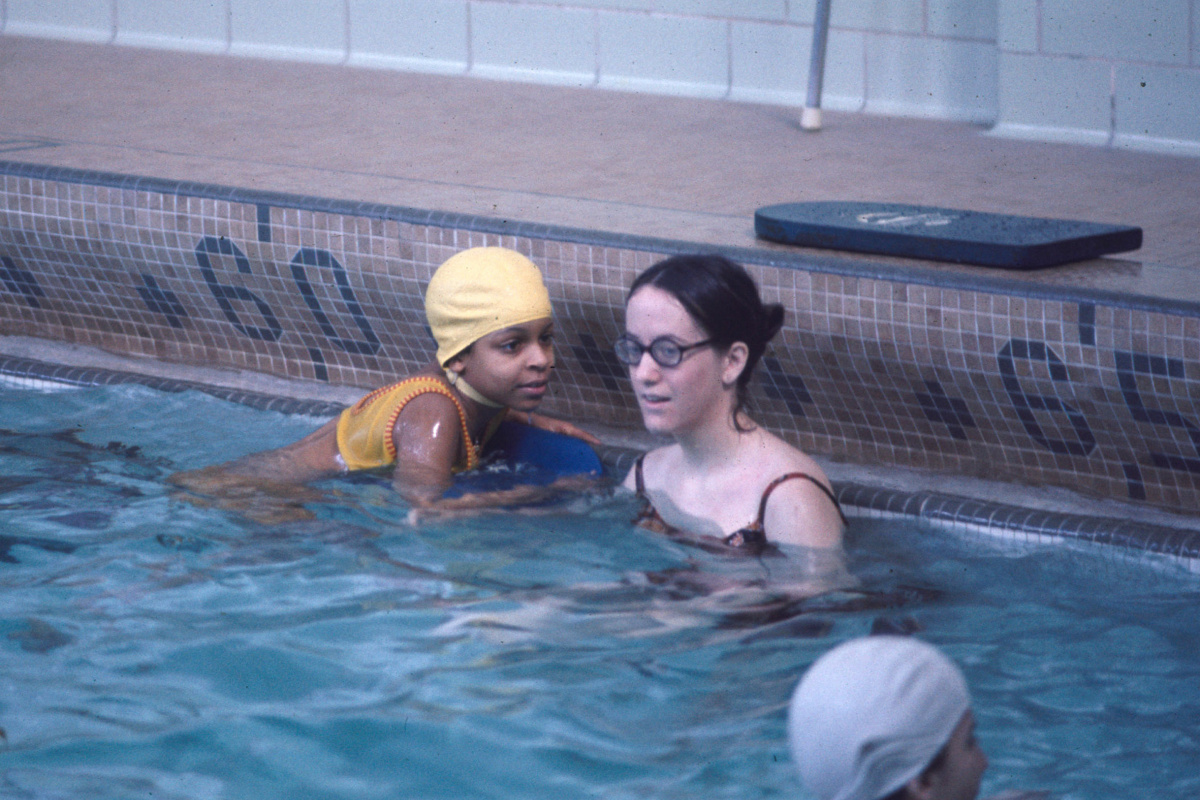 people swimming in a pool