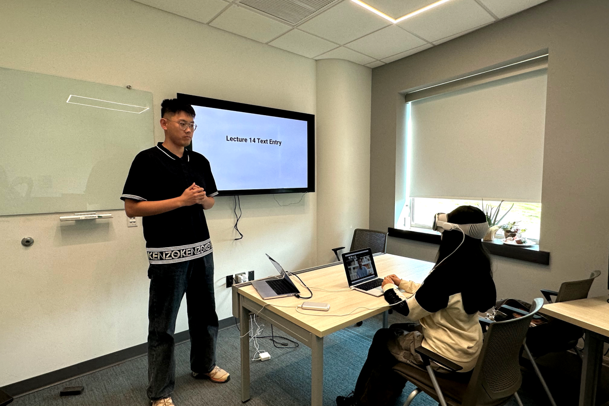 Professor Yukang Yan runs an experiment using the Apple Vision Pro. 