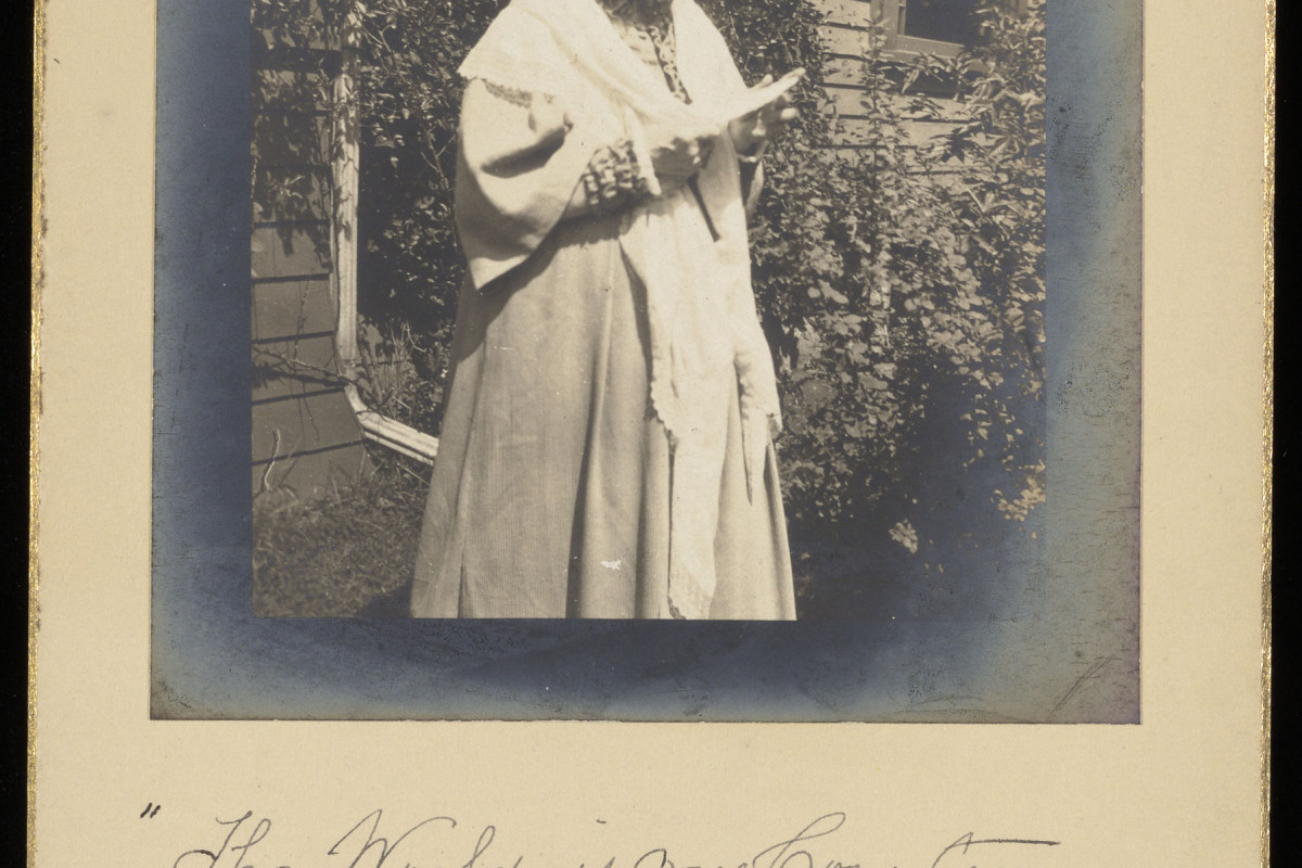 Isabella Beecher Hooker in her yard with handwritten inscription under her image