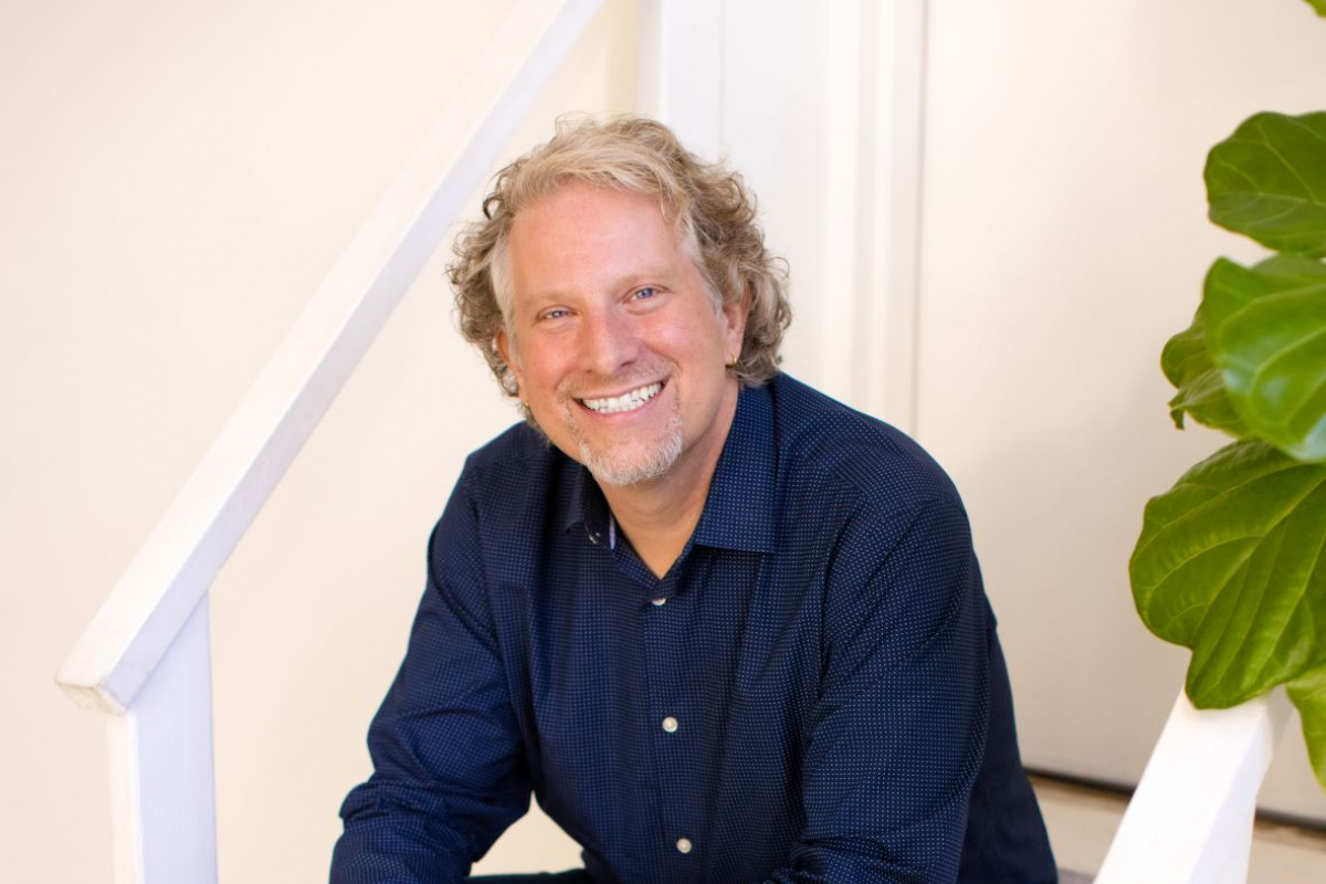 Peter Conners sitting on a small set of steps