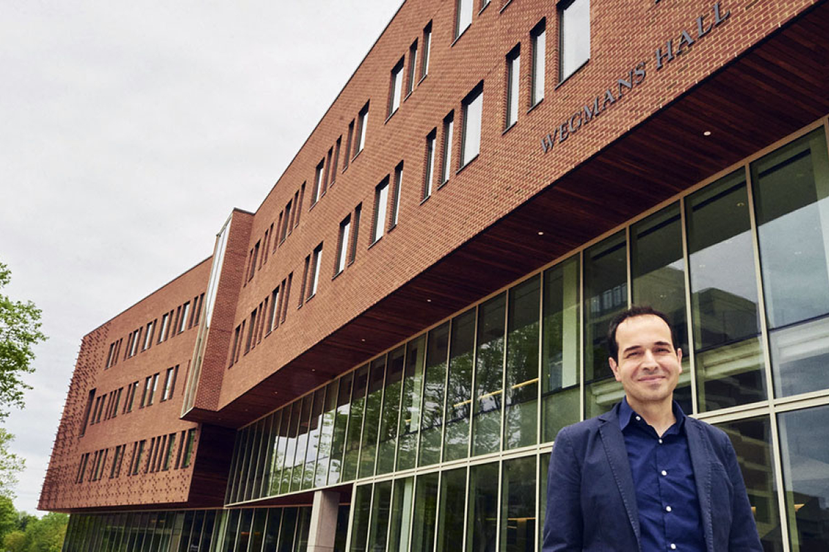 Professor Mujdat Cetin standing in front of Wegmans Hall.