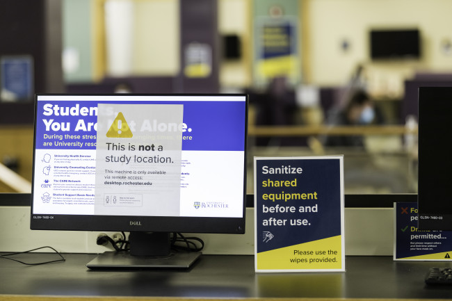 A computer monitor with a note on it that says it's not a study space