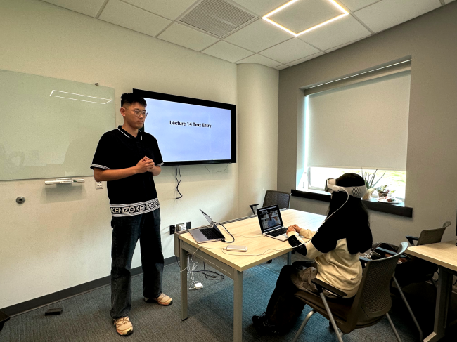 Professor Yukang Yan runs an experiment using the Apple Vision Pro.
