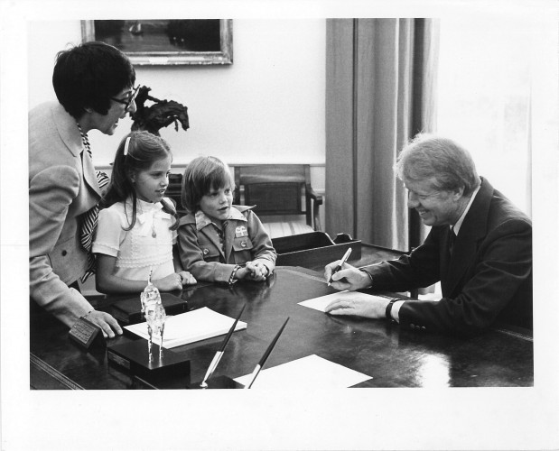Midge Costanza and President Jimmy Carter in Oval Office with visiting children
