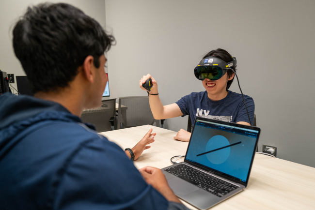 Running the virtual reality experiment on a user. 