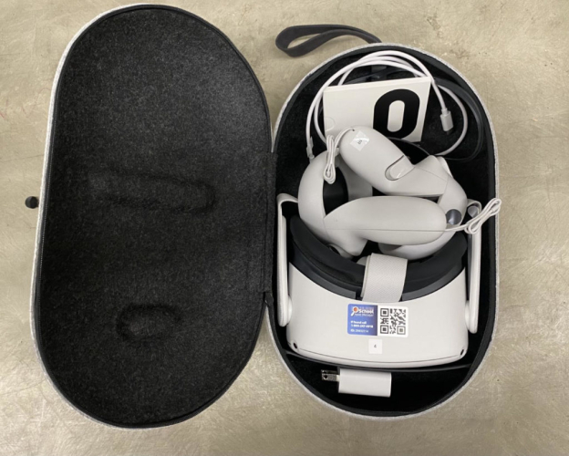 Meta quest virtual reality headset and controllers in its box.