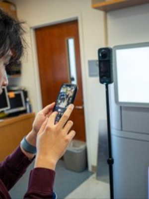 An undergraduate recording the lab with a 360 camera. 